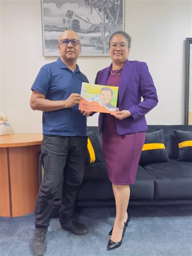 Minister of Amerindian Affairs, Hon. Sarah Browne Shadeek, was today presented with a children’s storybook about Guyana’s first Amerindian Parliamentarian, Stephen Campbell. | Ministry of Amerindian Affairs