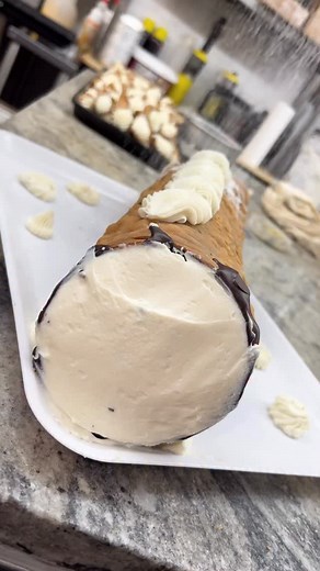 The family-size cannoli has entered the chat 🤌🇮🇹 Perfect for holidays, parties, or anytime you need to impress a room 🦃🎄 📍 289 Manhattan Ave, Brooklyn, NY 📞 (718) 387-2281 👕 Merch available 📲 Click the link in our bio for local delivery and national shipping 📦 #fortunatobros #fortunatobrothers #italianbaking #cannoli | Fortunato Brothers Café & Pasticceria