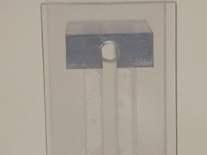 Experimental Measurement of Settling Velocity of Spherical Particles in Unconfined and Confined Surfactant-based Shear Thinning Viscoelastic Fluids