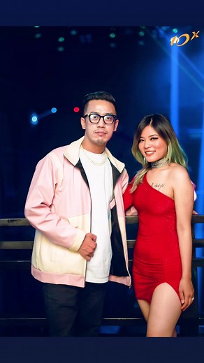 Nightclub Vibes: Stylish Duo in Colorful Lights