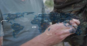 Man pulling paracord and tying knot on comrade's vest under military hex map for securing gear