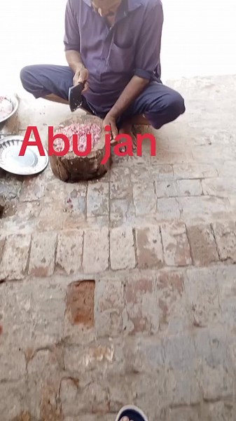 Traditional Meat Preparation in Rustic Kitchen