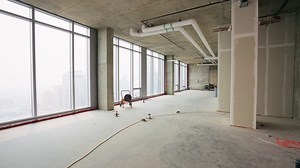 Premium stock video - Push in shot of an empty penthouse under construction, showcasing the spacious interior and potential design