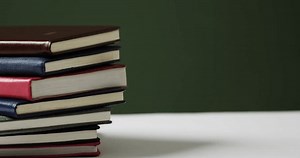 Close Stack Books On Green Background 库存影片视频（100% 免版税）1105105543 | Shutterstock