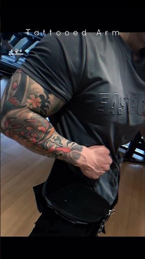 Aesthetic Tattooed Bicep Flex and Muscle Definition Showcase by Muscleverse
