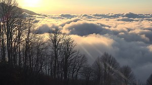 Sunrise at a cloudy top of the mountain - Free Stock Video