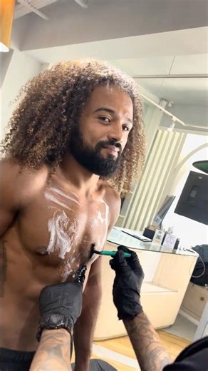 Lion Chest Tattoo with Script Lettering