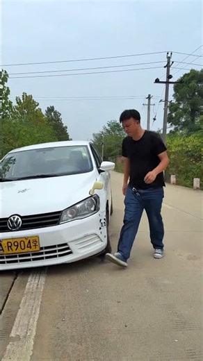 A Car's Front Wheel Fell Into A Large Ditch, But A Single Rock Fixed It.