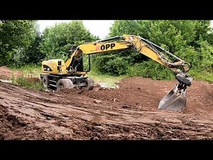 Cat M316D Beim Humusieren eines Regenrückhaltebecken. GoPro/ Cabview