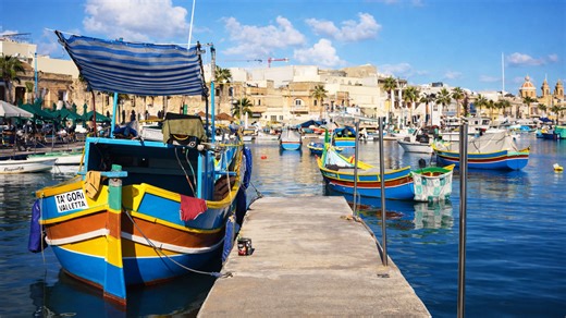 Walking through Marsaxlokk fishing harbor