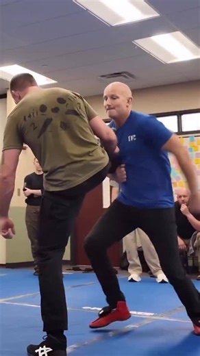 This finish of the snatch single isn’t a “wrestling move.” It’s a problem solver for active aggression. When a subject commits forward to swing, shove, or crash, you don’t meet force with force. You take the base away. Attacking behind the knee removes their ability to recover, forces a breakfall, and turns the ground into the impact instead of your hands or your head. From there, you’re not scrambling. You’re already moving into a familiar sequencing dominant leg drag position where control is 
