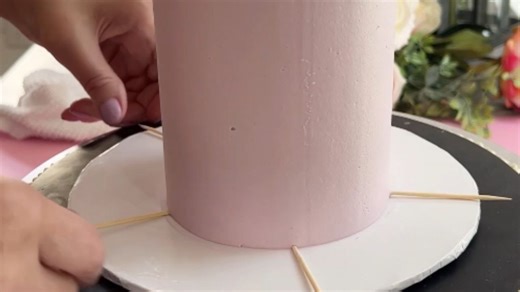 Cake Artist decorates a lavender haze cake by piping the frosting *Amazing Cake Art*