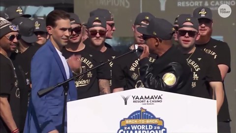 Ice Cube delivers World Series trophy to Dodgers at stadium rally