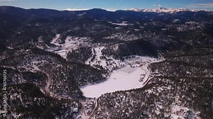 Evergreen Colorado aerial drone scenic landscape Mount Evan Bluesky three sisters lake house golf course Jeffco high school winter morning Denver open space Etown forward pan up reveal motion