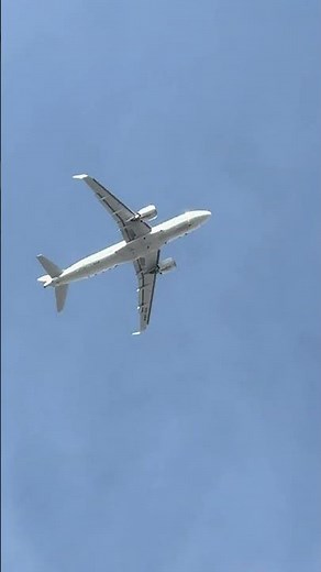 Brussels Airlines A320 Climbs Powerfully Into the Grey Blue Sky