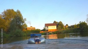 Little girl is swimming in a pond with an inflatable circle. 1920X1080 Full Hd.