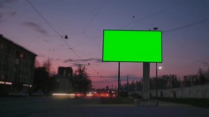 Time Lapse. A Billboard with a Green Screen on a Busy Street