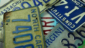 different colored license plates from american cars spinning