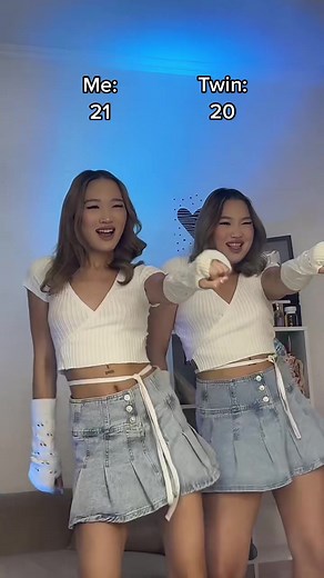 Twin Sisters Synchronized Dance Routine in Matching Outfits