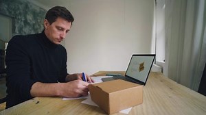 Cardboard industry. The designer develops the product packaging. Paper industry.