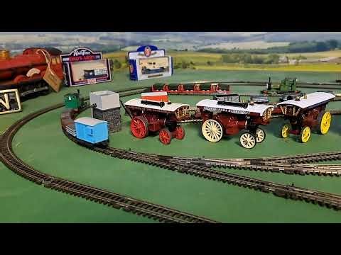 Bachmann Peter Sam pulling 2 brown, 1 red, 1 grey slate wagons and blue brakvan