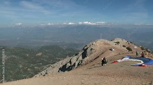 Paragliding from mountain Babadag in Turkey near the city of Fethiye. Feeling of adrenaline, extreme, euphoria and freedom at height of bird's flight. Awesome energy of the ascending air currents.