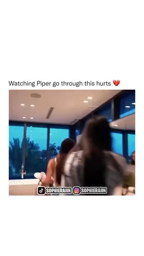 SCARLETT XO 🌈 on Instagram: "In this short video clip, a tense interaction unfolds between three young women in a modern, upscale home. The scene begins in a spacious bathroom featuring large windows with a view of the evening sky. One woman, wearing a striped dress, appears distressed as she gathers her belongings from the counter. Another woman, in a denim outfit, asks, “Is this yours?” to which the woman in the dress responds with a short “Yeah.” The atmosphere is clearly strained; the woman