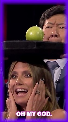 Heidi Klum SCREAMS in terror as an apple is shot off her head!