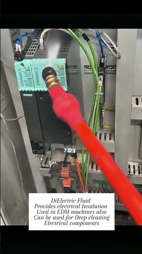 Electric panel cleaning with dielectric fluid