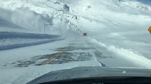 The DOT&PF Thompson Pass crew opened up the Richardson Highway yesterday evening after a closure that lasted about two days. Want to know more about what happened? In a winter that has brought 470 inches of snow to the pass so far, the crew was battling avalanches followed by crazy high winds (up to 100 miles per hour) that created deep drifting and reduced visibility to the point that our operators couldn’t see ten feet in front of them. Using GPS technology to guide their equipment through the