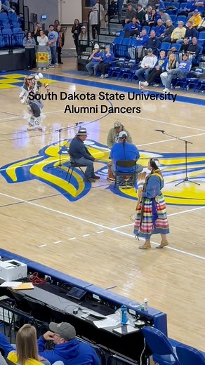 💙💛🤍 SDSU Alumni Dance during halftime for Native Heritage Night Basketball game. Pidamayaye for all you do and for asking me to dance 🥹🫶🏽 #gojacks #alumni #powwow #powwowdancer #nativeheritagemonth #NativeAmericanHeritageMonth #SDSU #basketball #basketballgame #GoBigBlue #traditionaldancer | Ribbon Skirts by Indigenousmamabear