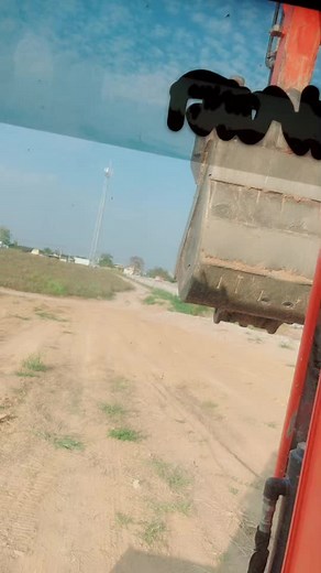 Inside a Red Excavator: Construction Machinery Operation