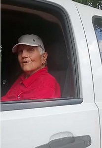 They are at a funeral, but this guy in truck is blocking the way for them