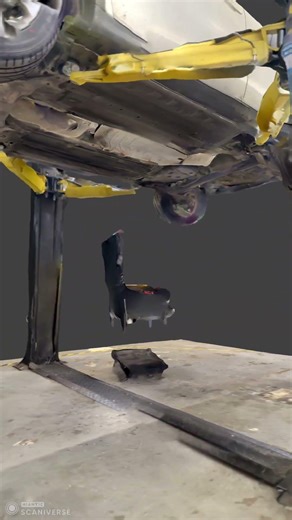3d scan of a two post car lift with a Nissan with no exhaust