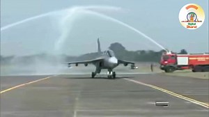 LCA Tejas Mk 1A gets a water cannon salute after its maiden test flight today. | Modi For New India