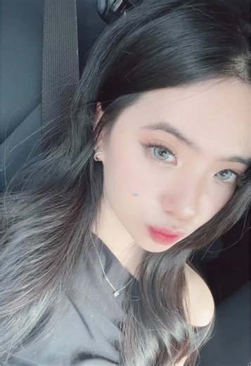 A Relaxed Car Ride with a Woman in Black Outfit