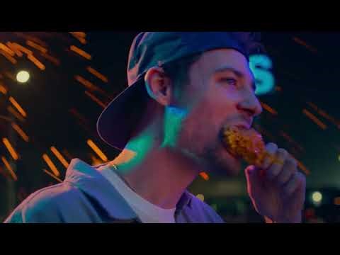 Church’s Texas Chicken Woman rapping in front of a fire