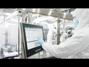 Automated filling of syringes under aseptic conditions