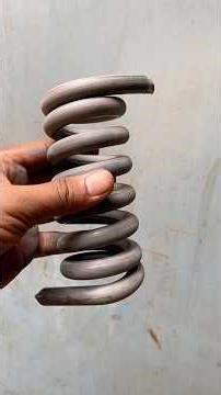 "Skilled Craftsman Making a Strong Metal Spring"