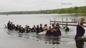 Wedding party gets soaked when dock collapses