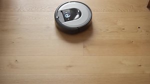 Robotic Vacuum Cleaner Cleaning Wood Floor with Sound and Finish Melody