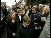 MS Clerics and members of Larry Grayson's funeral procesion along...