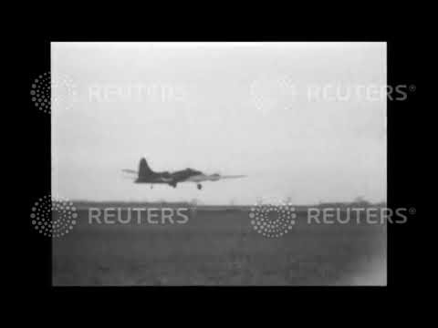 1943 FRANCE: Over Paris in broad daylight: Paramount cameraman files with US bombers which raided