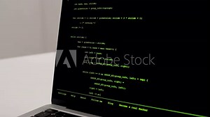 Developer is browsing html code on the computer screen. Scroll of HTML Web Page Code. Programming code abstract technology background. Computer script concept. High quality 4k footage