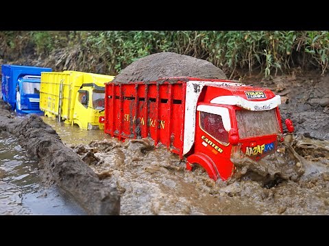 Aa Zafran's Shaky truck, Wahyu Abadi carries a load of sand through muddy roads