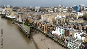 Wapping London UK riverside apartments Panning drone aerial