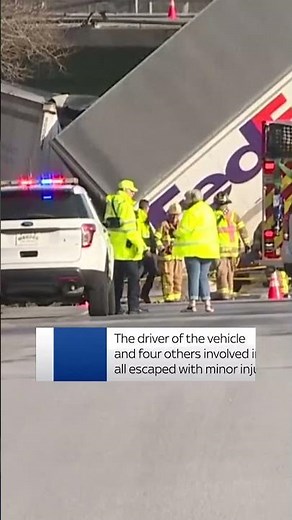 FedEx truck hangs off bridge in New York following crash