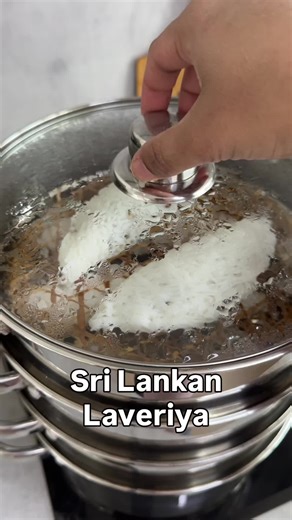 Sri Lankan Laveriya Recipe ~~SAVE NOW~~ If you love string hoppers, you will definitely love Laveriya. Laveriya/ Lavariya is a traditional Sri Lankan sweet made from soft rice flour dough filled with sweetened grated coconut, usually cooked with kithul jaggery/treacle and cardamom (pani pol). The filled dough is shaped into long rolls, wrapped in banana leaves, and steamed until tender. Lavariya has a mildly chewy texture with a rich, aromatic coconut filling and is commonly prepared for Sri Lan