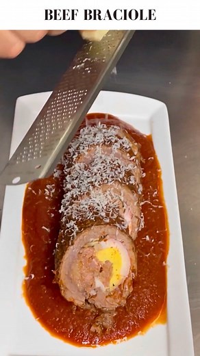 Beef Braciole… Process 👇 Braciola, or beef braciole, is steak that is stuffed with a variety of different things. Every family does it different. Some just put breadcrumbs and cheese, others put meat, it’s all about what you like. I pounded out some flank steaks and stuffed them with crumbled Italian sausage, parmigiana, parsley, panko bread crumbs and hard boiled eggs. You can tie them with butchers twine, but I use this meat netting I got on Amazon. So easy! The sauce is onions, garlic, parsl