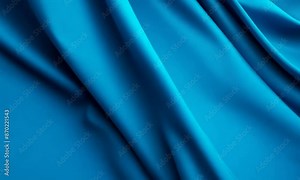 Luxurious blue silk satin fabric with smooth folds and a shiny texture in a soft, wavy backdrop